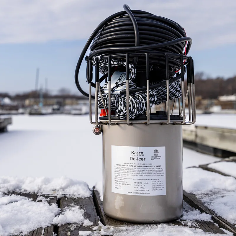 Kasco 3400D de-icer photographed on a snowy dock